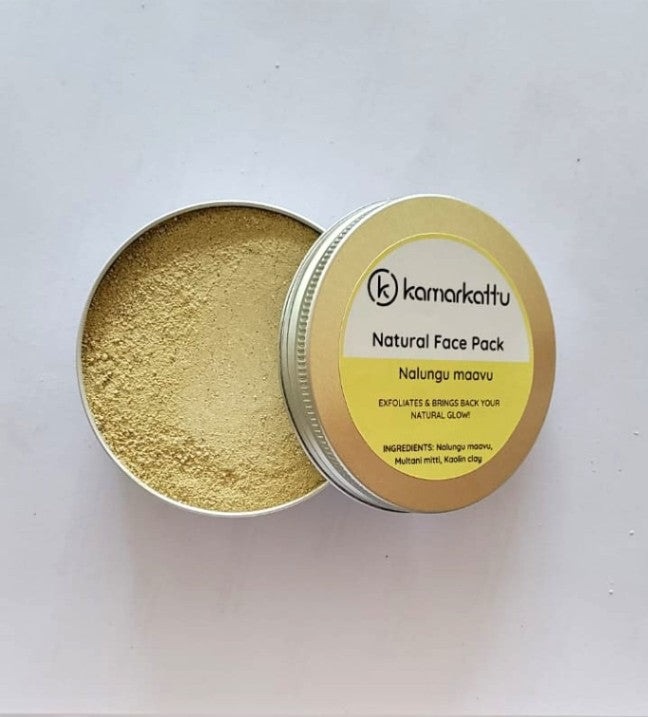 Open tin of yellow Kamarkattu Nalungu Maavu face pack powder beside its labelled lid.